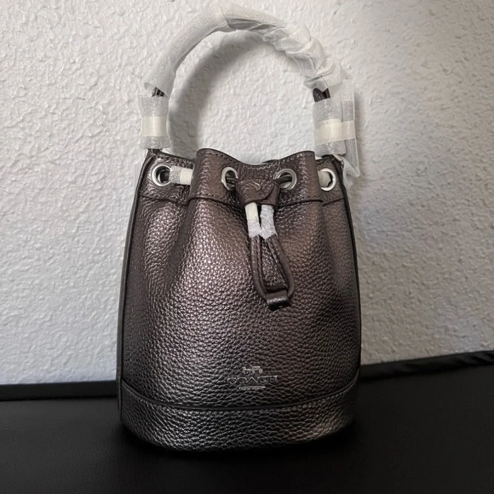 NWT COACH DEMPSEY DRAWSTRING BUCKET BAG 15 IN SILVER/METALLIC GUNMETAL CROSSBODY